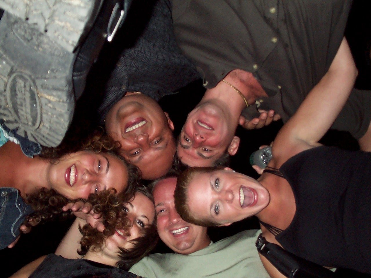 Group of friends gathered outdoors after dark